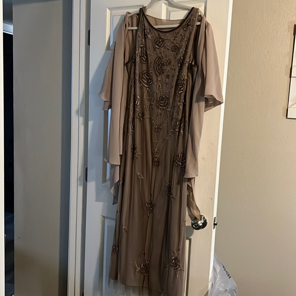Women’s formal mother of bride dress worn once. Beaded taupe yea length